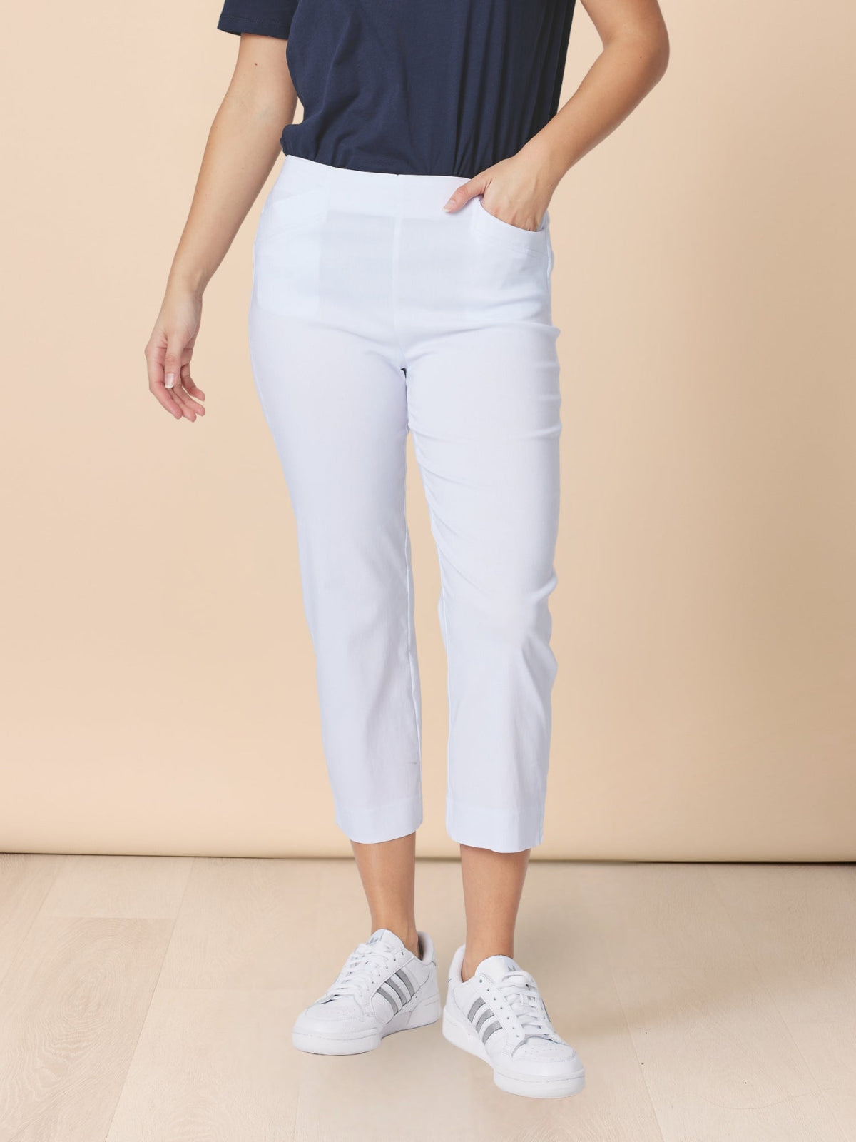 Image of a model wearing Pants. Product name - Zara Stretch Pant White in White colour by brand - Threadz