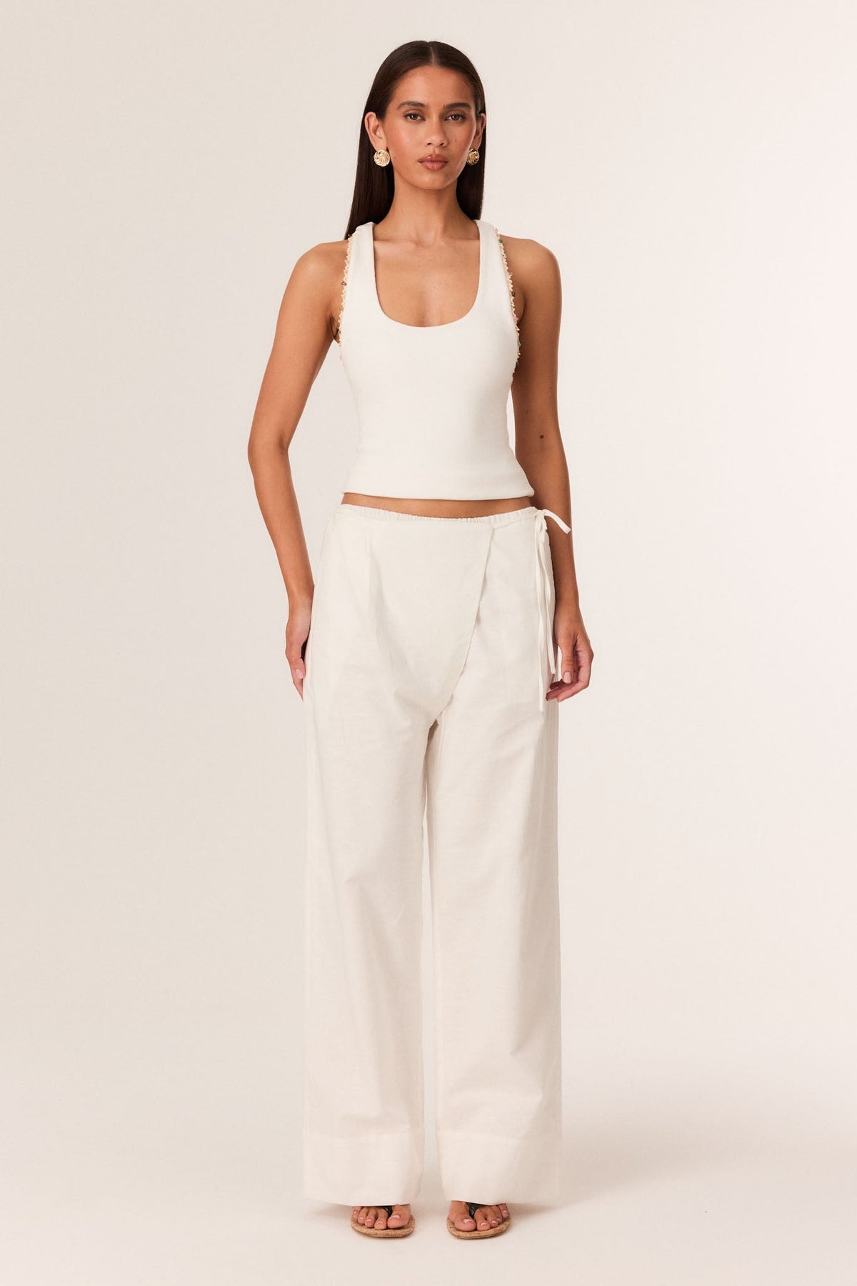 Image of a model wearing Pants. Productname: SNDYS MUSA PANTS in Off White colour by brand - SNDYS