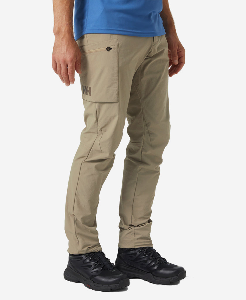 Image of a model wearing Pants. Product name - BRONO SOFTSHELL PANT, Pebble in Pebble colour by brand - Helly Hansen