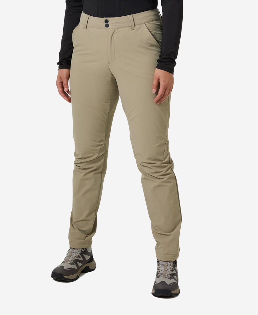 Image of a model wearing Pants. Product name - W BRONA SOFTSHELL PANT, Pebble in Pebble colour by brand - Helly Hansen