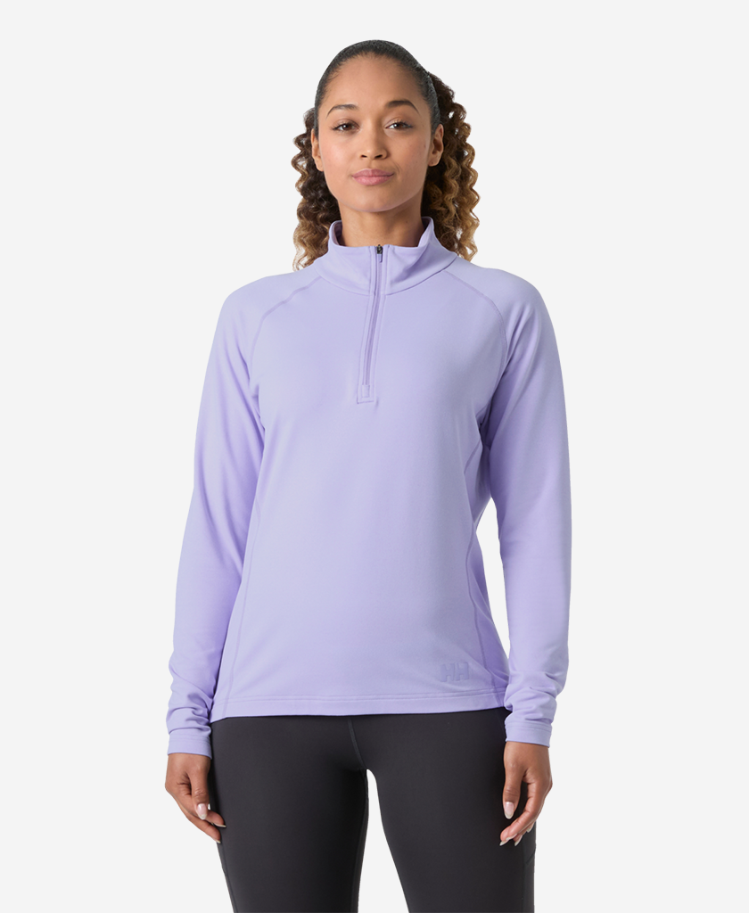 Image of a model wearing Outerwear. Product name - W TYRI KNIT 1/2 ZIP, Bright Lavender in Bright Lavender colour by brand - Helly Hansen