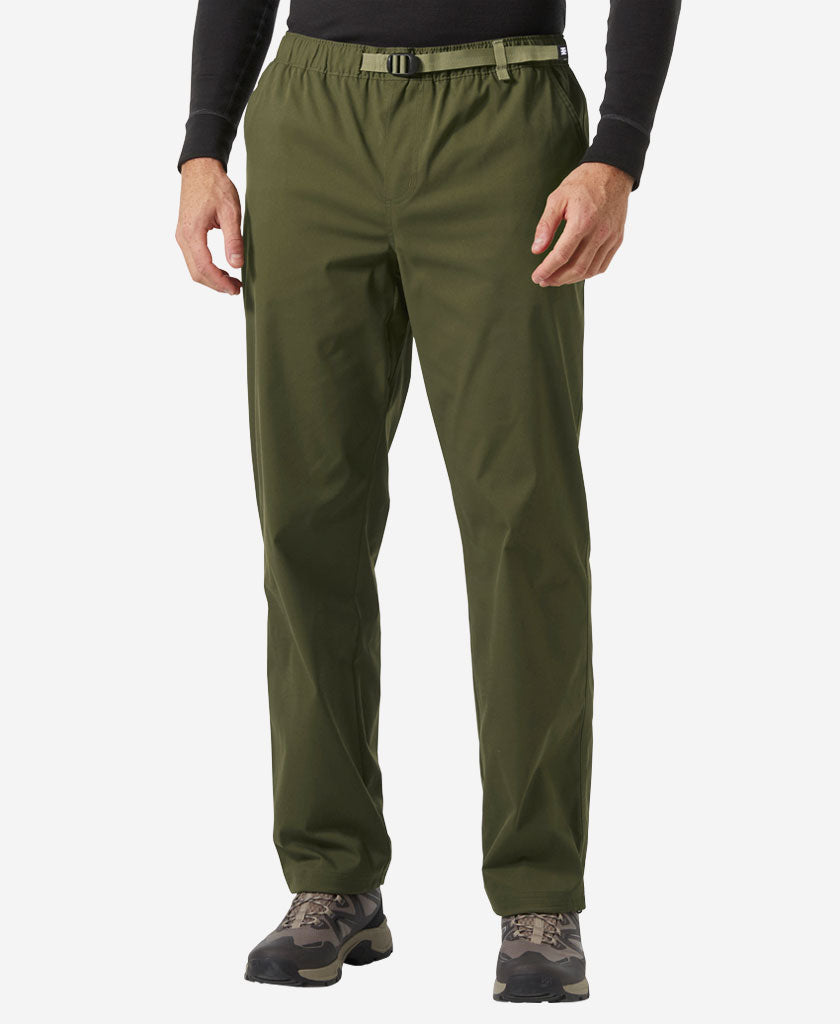 Image of a model wearing Pants. Product name - HOLMEN RELAXED PANT, Utility Green in Utility Green colour by brand - Helly Hansen