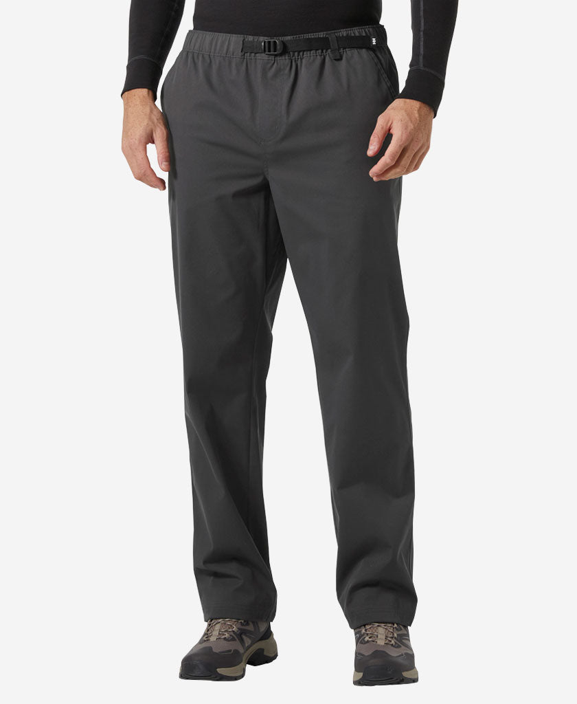 Image of a model wearing Pants. Product name - HOLMEN RELAXED PANT, Ebony in Ebony colour by brand - Helly Hansen
