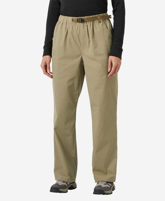 Image of a model wearing Pants. Product name - W HOLMEN RELAXED PANT, Pebble in Pebble colour by brand - Helly Hansen