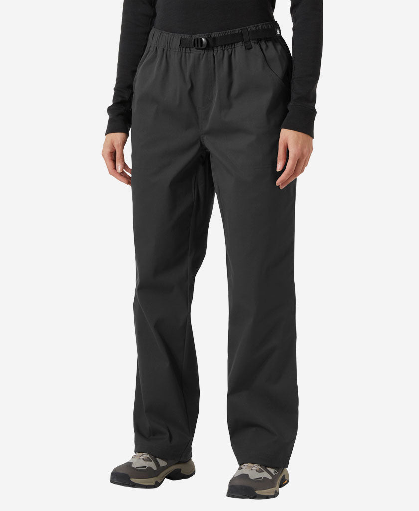 Image of a model wearing Pants. Product name - W HOLMEN RELAXED PANT, Ebony in Ebony colour by brand - Helly Hansen