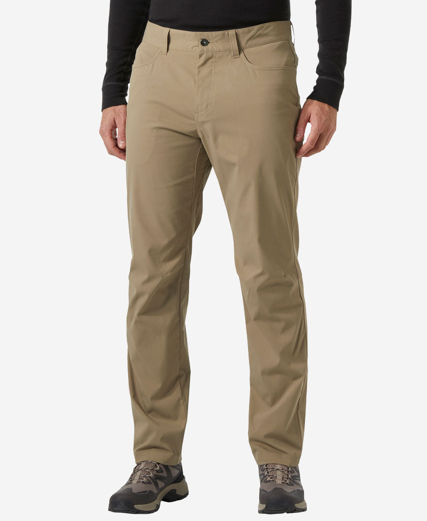 Image of a model wearing Pants. Product name - HOLMEN 5 POCKET PANT, Pebble in Pebble colour by brand - Helly Hansen