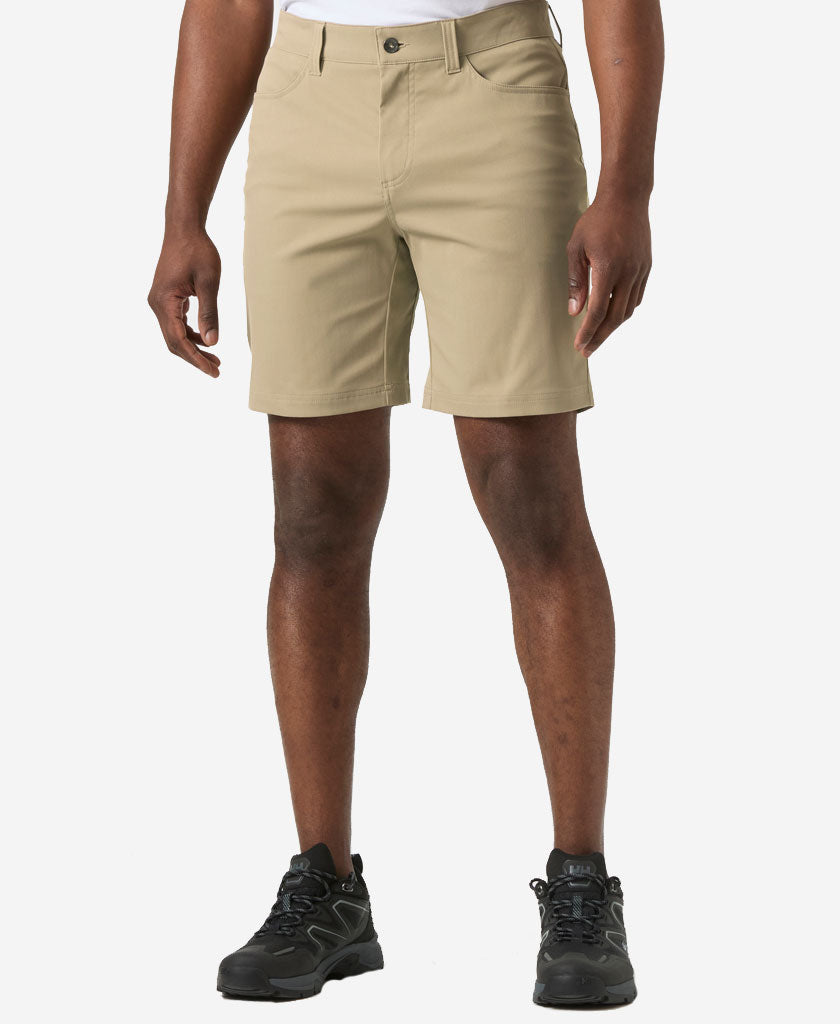 Image of a model wearing Shorts. Product name - HOLMEN 5 POCKET SHORT, Pebble in Pebble colour by brand - Helly Hansen