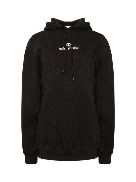 Image of a model wearing Outerwear. Productname: BALENCIAGA Sponsor Logo Hoodie in Black colour by brand - BALENCIAGA