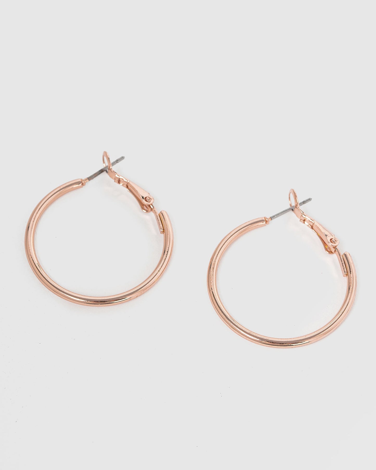 Image of Earrings. Product name - Rose Gold Fine Hoop Earrings in Rose Gold colour by brand - Colette by Colette Hayman