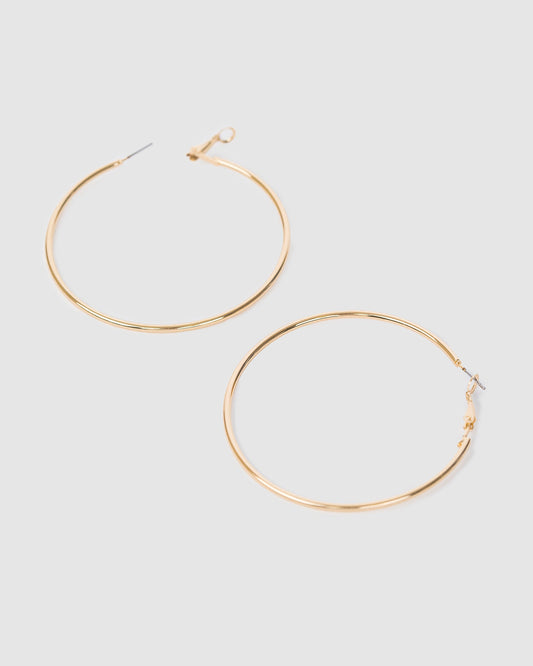 Image of Earrings. Productname: Colette Gold Fine Hoop Earrings 60mm in Gold colour by brand - Colette