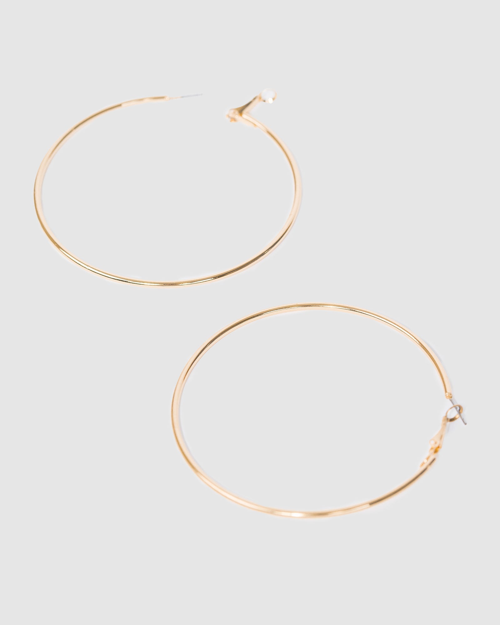 Image of Earrings. Productname: Colette Gold Fine Hoop Earrings 70mm in Gold colour by brand - Colette