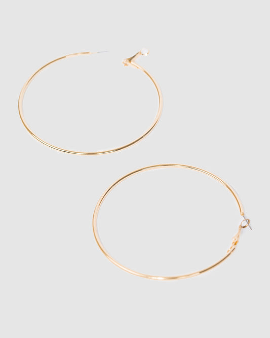 Image of Earrings. Productname: Colette Gold Fine Hoop Earrings 70mm in Gold colour by brand - Colette
