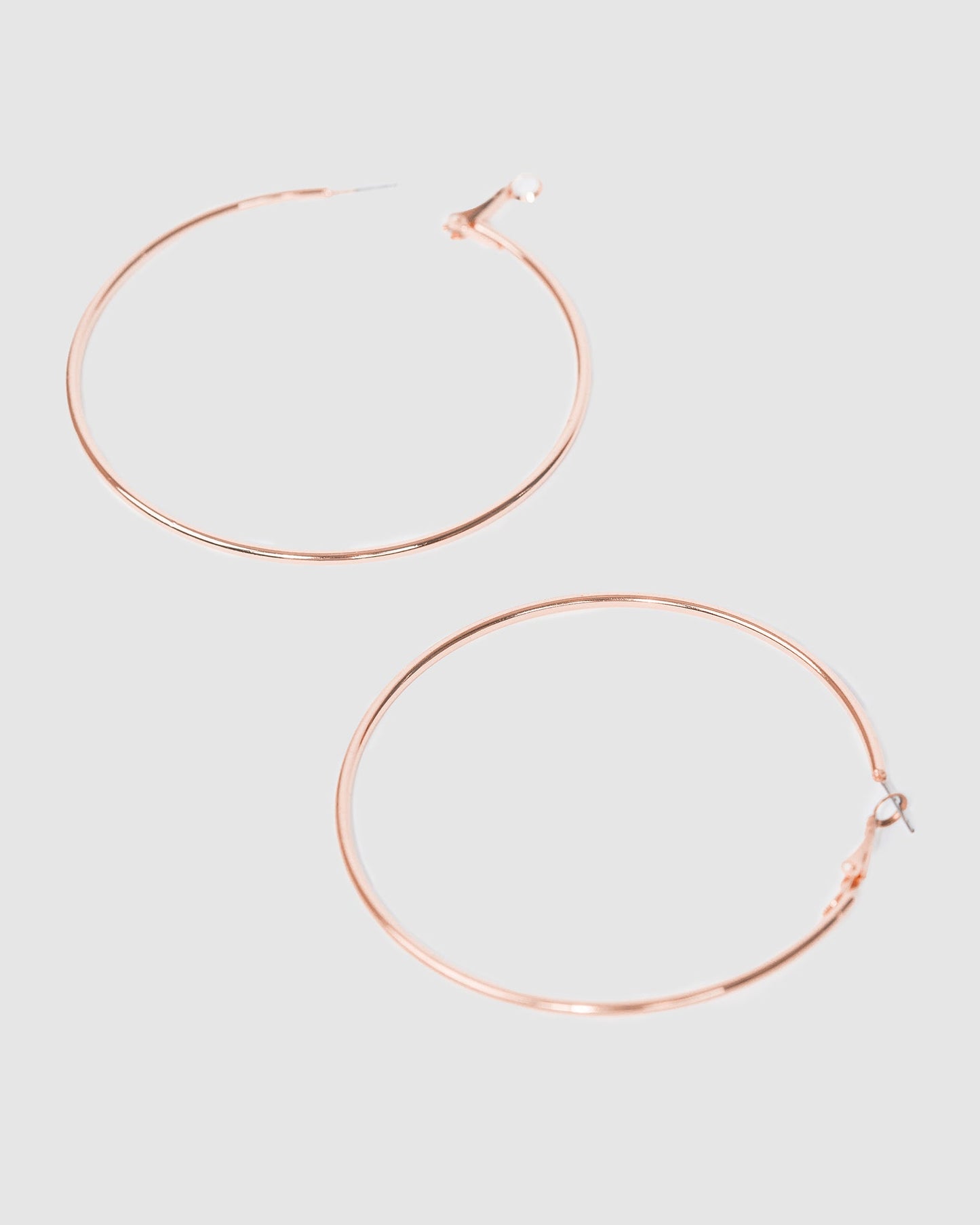 Image of Earrings. Productname: Colette Rose Gold Fine Hoop Earrings 70mm in Rose Gold colour by brand - Colette