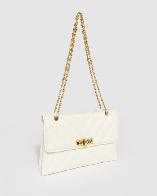 Image of Bags. Productname: White Zion Arrow Crossbody in White colour by brand - Colette