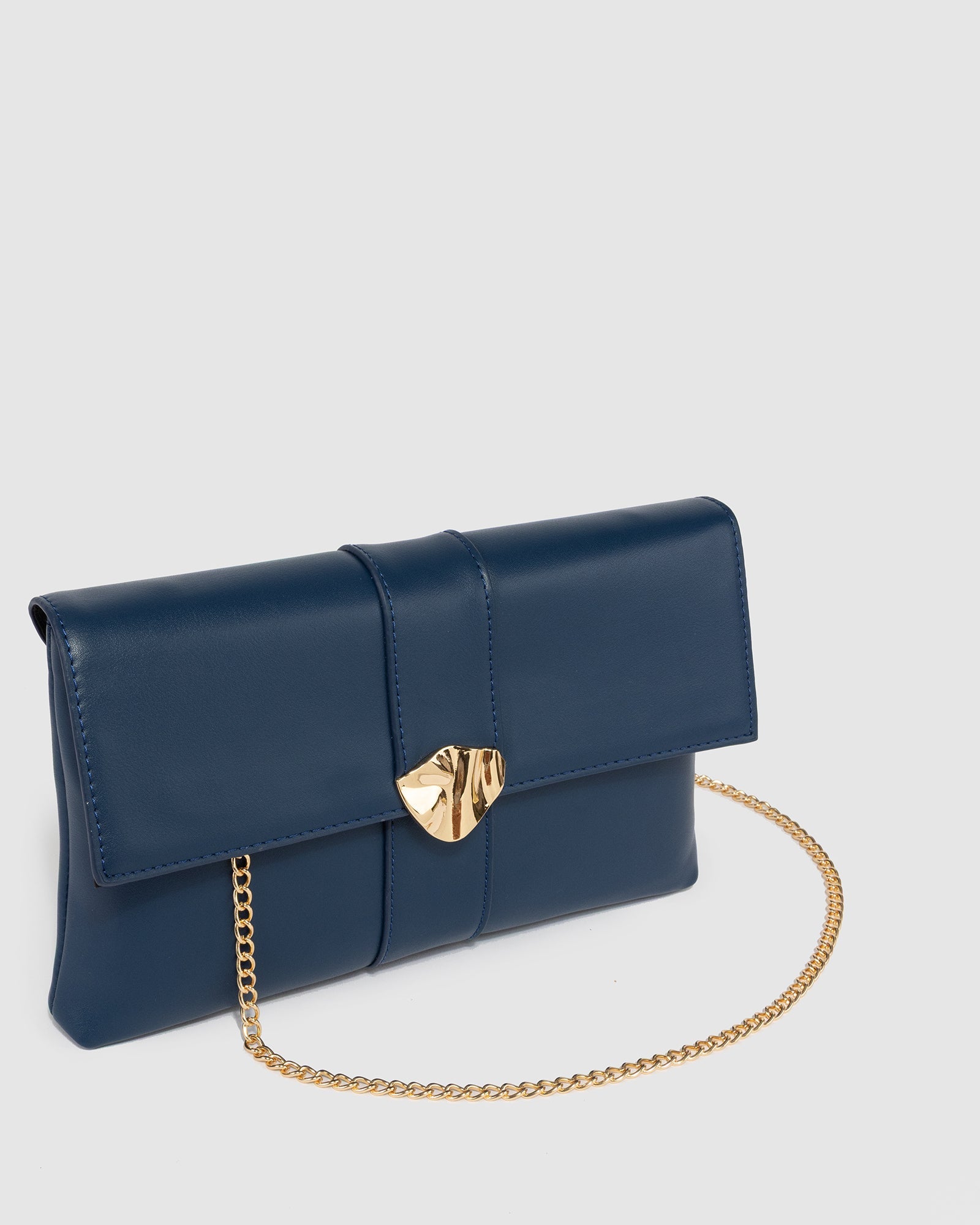 Image of Clutch Bags. Productname: Navy Polly Flap Clutch in Navy colour by brand - Colette