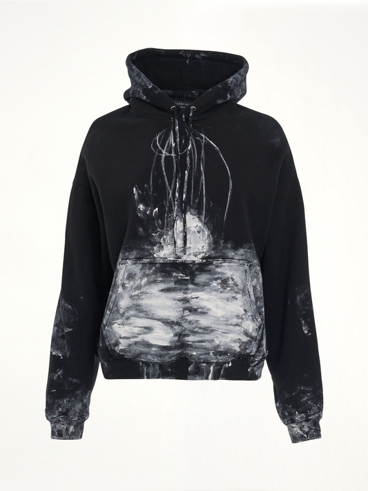 Image of a model wearing Outerwear. Productname: BALENCIAGA Painter Fitted Hoodie in BLACK colour by brand - BALENCIAGA