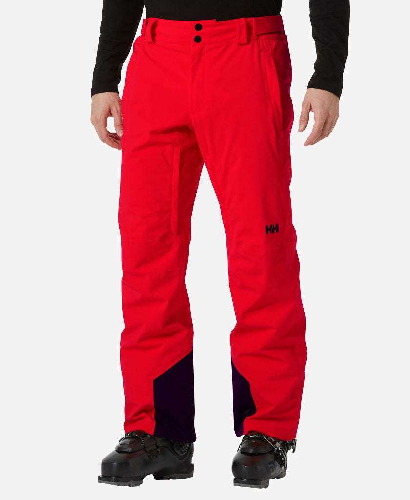 Image of a model wearing Pants. Product name - RAPID PANT, 163 Red in Red colour by brand - Helly Hansen
