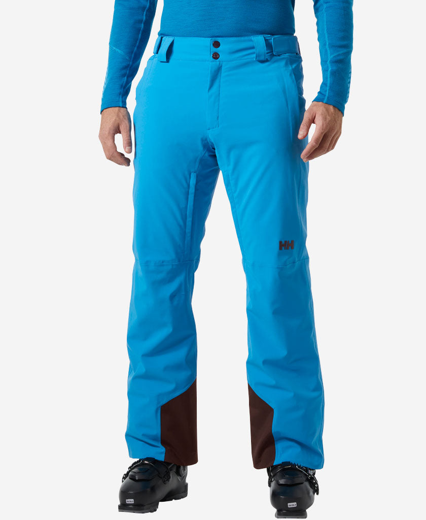 Image of a model wearing Pants. Product name - RAPID PANT, Neptune Blue in Neptune Blue colour by brand - Helly Hansen