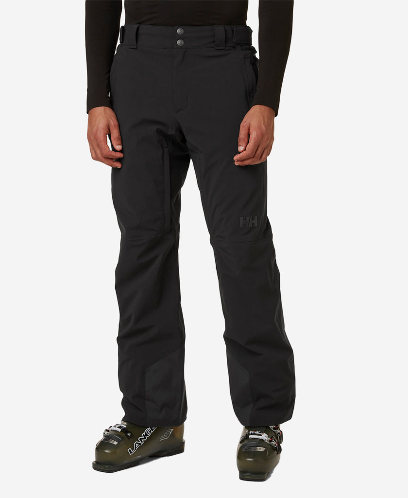 Image of a model wearing Pants. Product name - RAPID PANT, Black in Black colour by brand - Helly Hansen