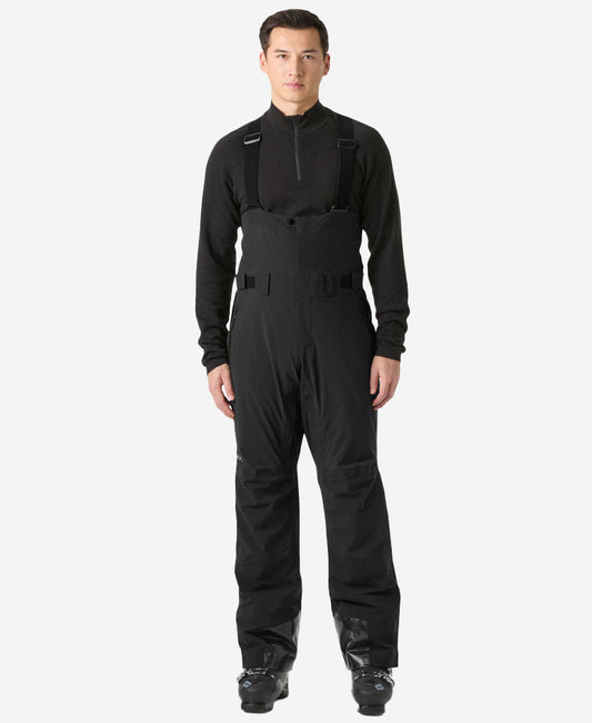 Image of a model wearing Pants. Product name - ALPHA BIB PANT, Black in Black colour by brand - Helly Hansen