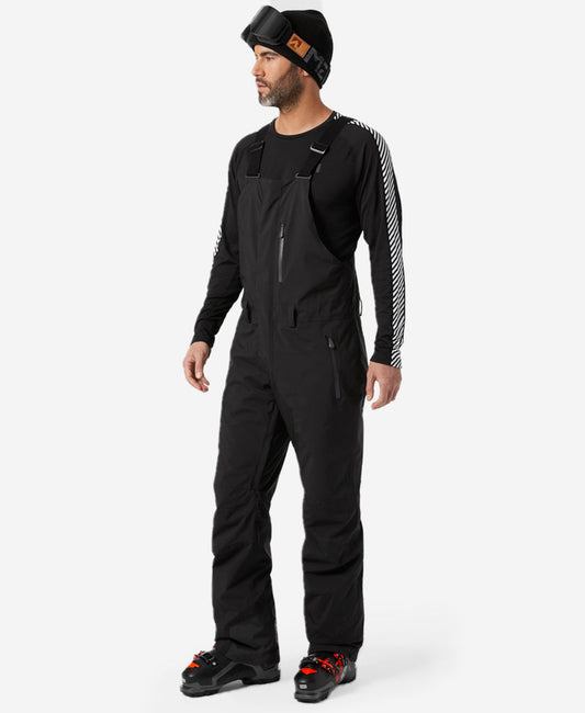 Image of a model wearing Pants. Product name - LEGENDARY INSULATED BIB PANT, Black in Black colour by brand - Helly Hansen