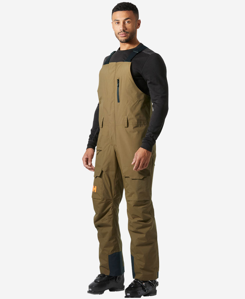 Image of a model wearing Pants. Product name - SOGN BIB CARGO PANT, Sepia in Sepia colour by brand - Helly Hansen