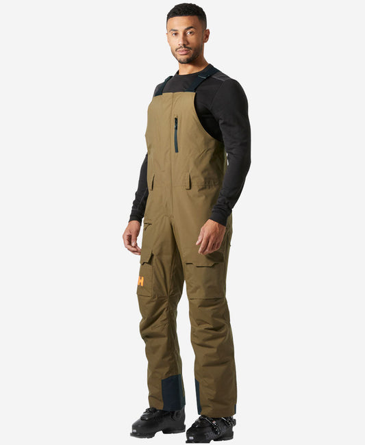 Image of a model wearing Pants. Product name - SOGN BIB CARGO PANT, Sepia in Sepia colour by brand - Helly Hansen