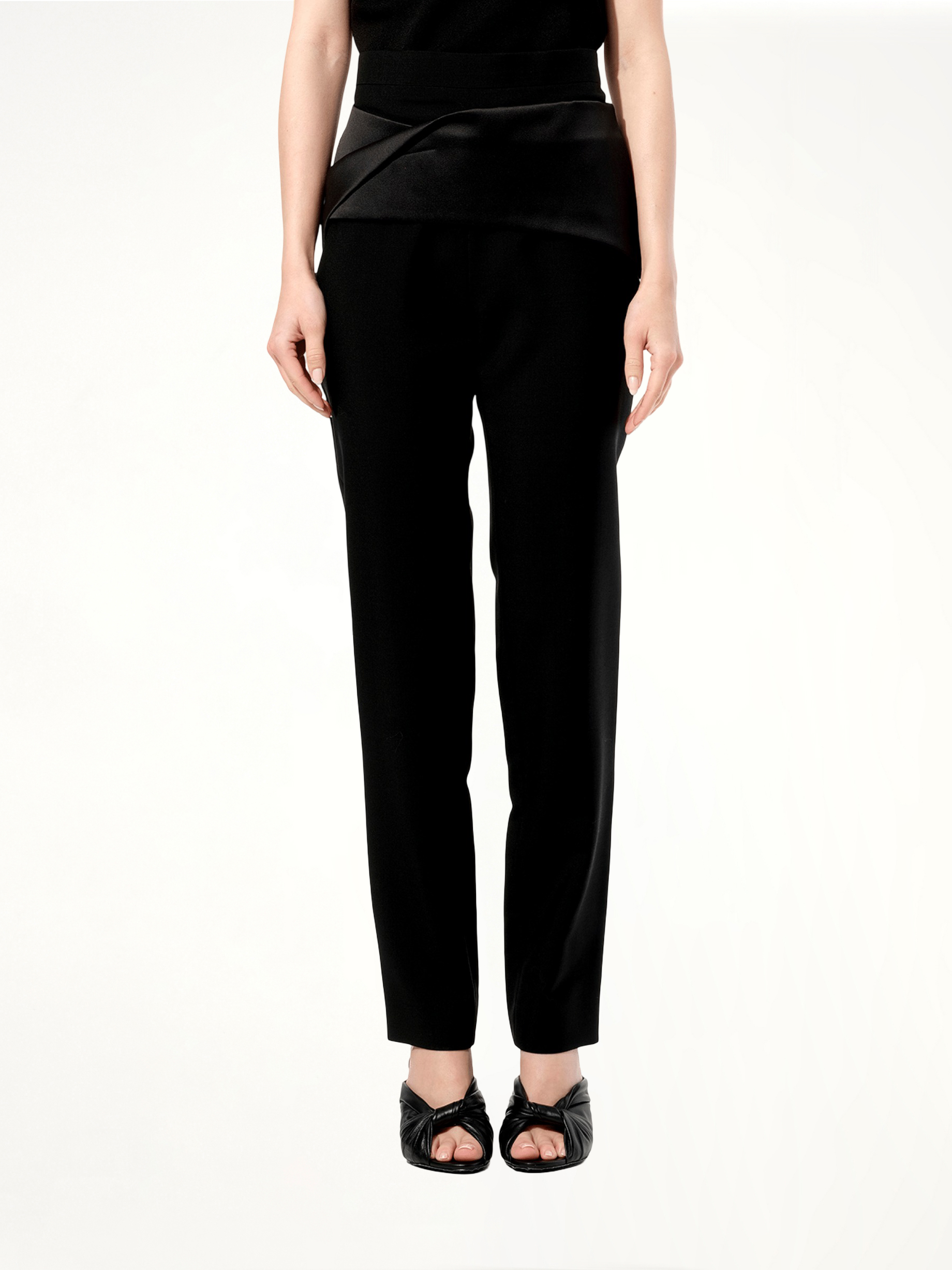 Image of a model wearing Pants. Productname: BALENCIAGA Pants in Black colour by brand - BALENCIAGA