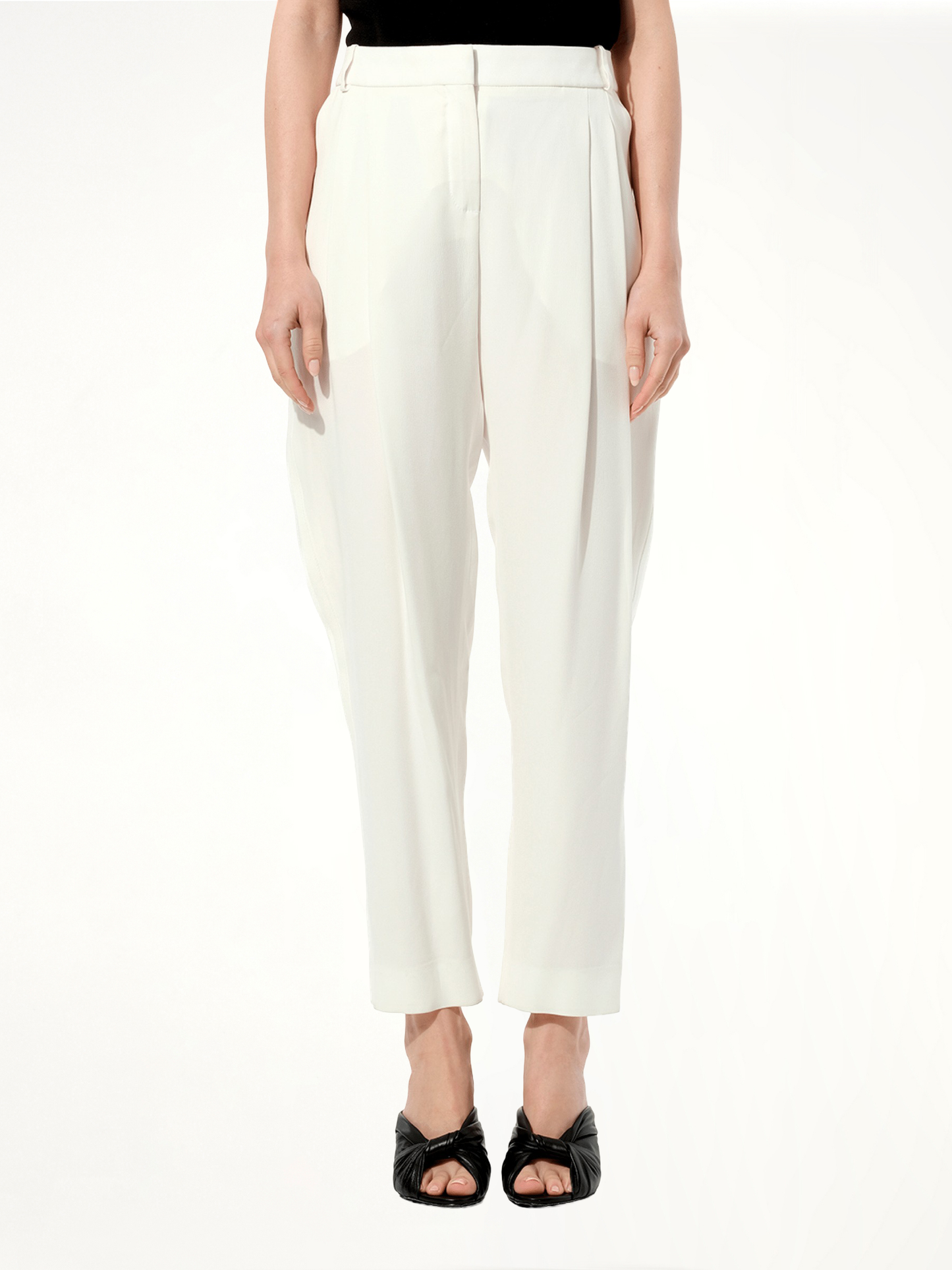 Image of a model wearing Pants. Productname: BALENCIAGA Pants in WHITE colour by brand - BALENCIAGA