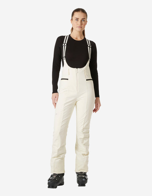 Image of a model wearing Pants. Product name - W AVANTI SOFTSHELL BIB PANT, Snow in Snow colour by brand - Helly Hansen