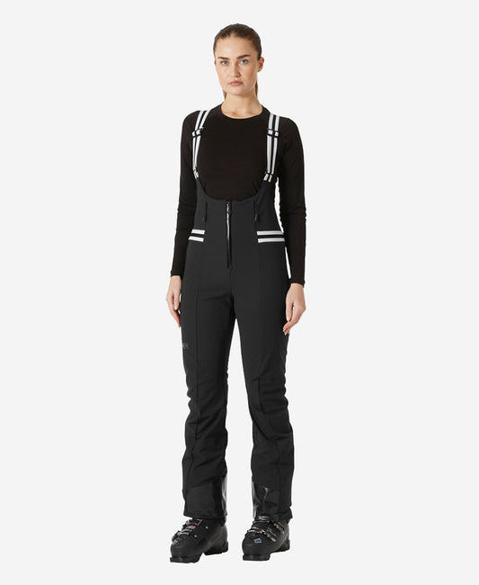 Image of a model wearing Pants. Product name - W AVANTI SOFTSHELL BIB PANT,Black in Black colour by brand - Helly Hansen