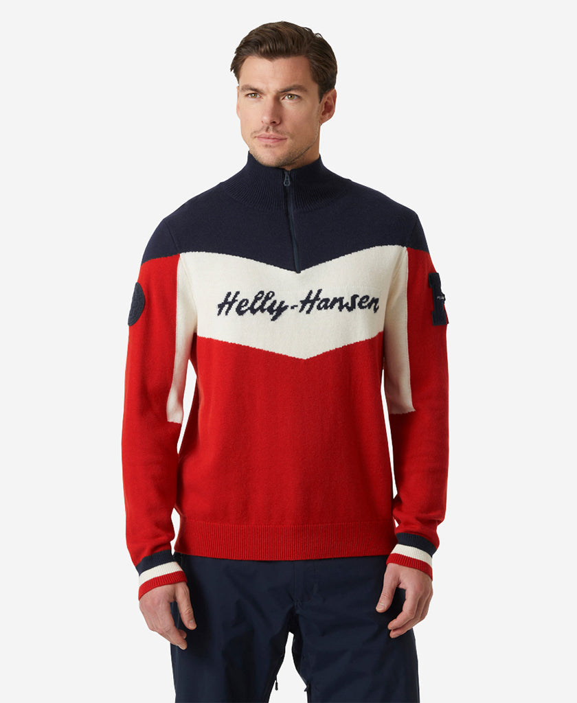 Image of a model wearing Outerwear. Product name - APRES KNITTED SWEATER, Red in Red colour by brand - Helly Hansen
