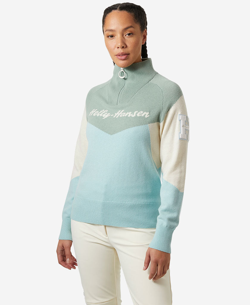 Image of a model wearing Outerwear. Product name - W APRES KNITTED SWEATER, Barely Blue in Barely Blue colour by brand - Helly Hansen