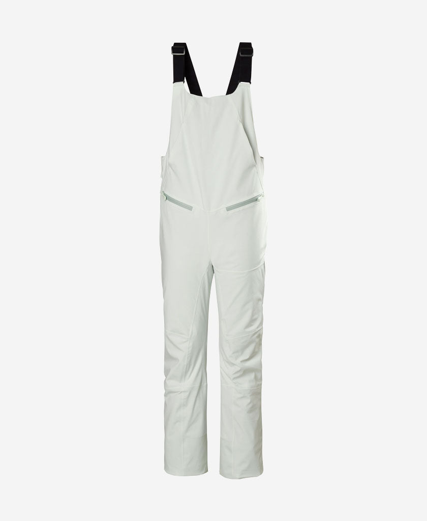 Image of a model wearing Pants. Product name - W ALPHELIA BIB PANT, Seafoam in Seafoam colour by brand - Helly Hansen
