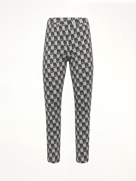 Image of a model wearing Pants. Productname: WE11DONE Fitted Knit Side Open Jacquard Trouser in White colour by brand - WE11DONE