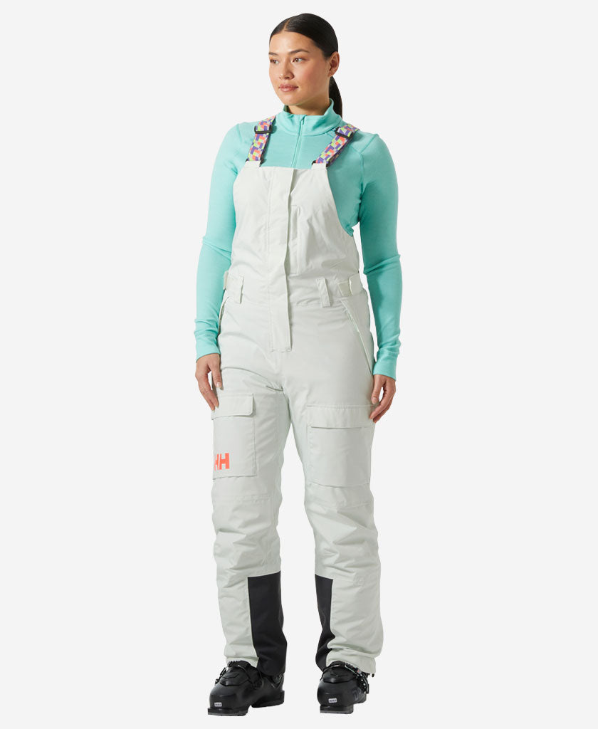 Image of a model wearing Pants. Product name - W SWITCH CARGO BIB PANT, Seafoam in Seafoam colour by brand - Helly Hansen