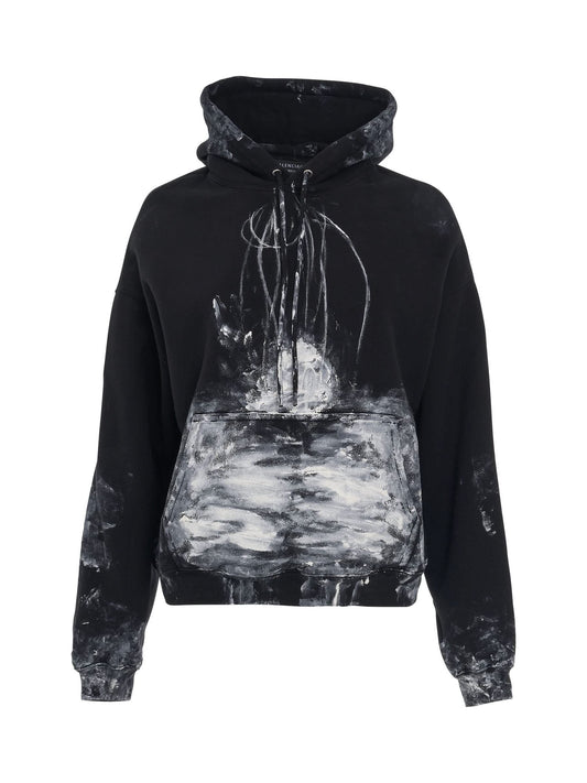 Image of a model wearing Outerwear. Productname: BALENCIAGA Painter Fitted Hoodie in Black colour by brand - BALENCIAGA