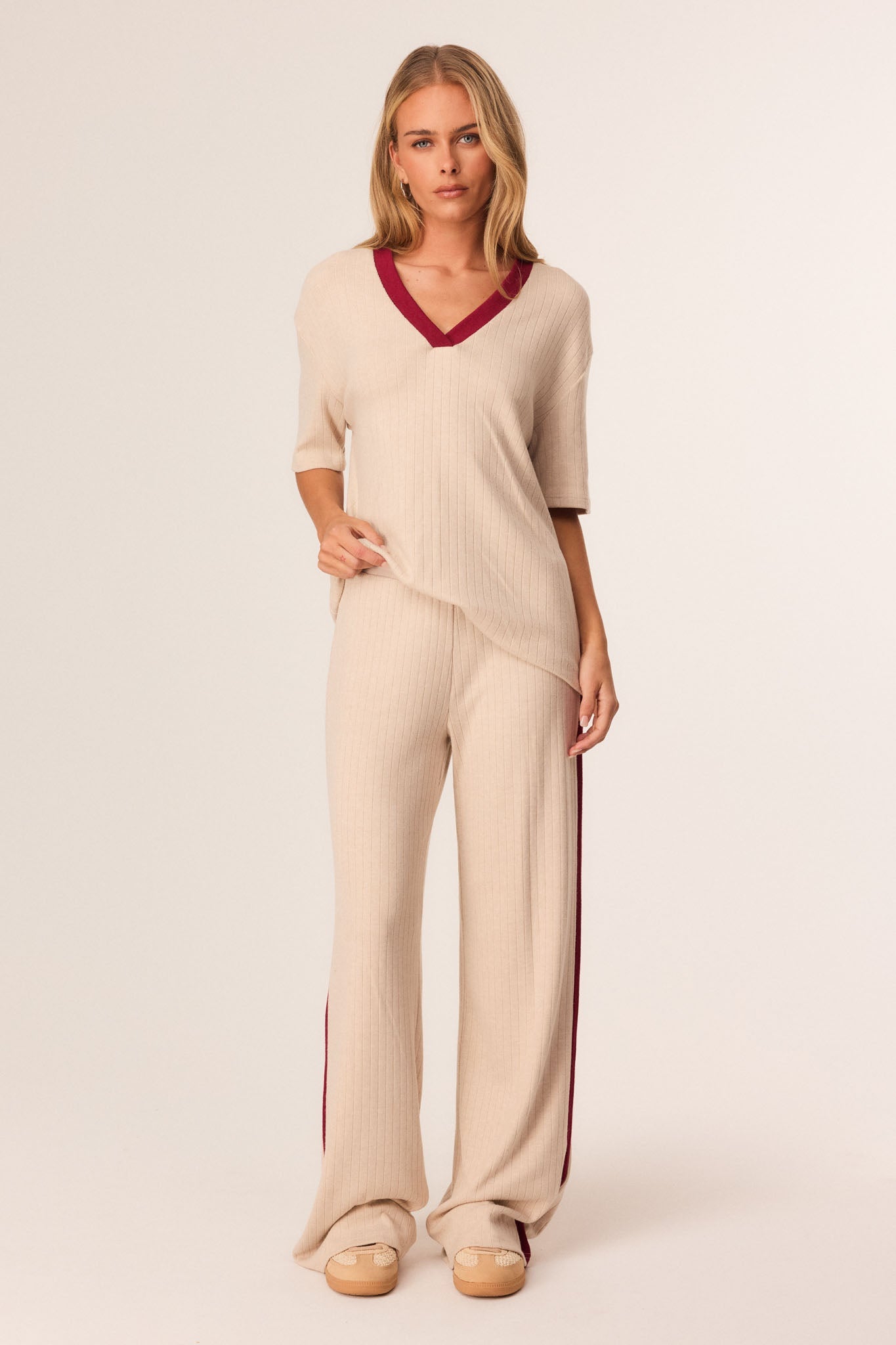 Image of a model wearing Pants. Productname: SNDYS HARLYNN PANTS in Sand colour by brand - SNDYS