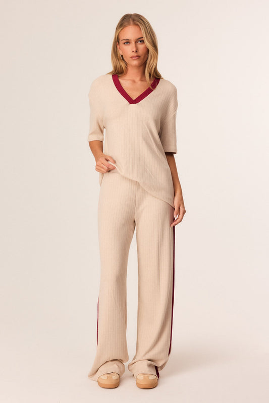 Image of a model wearing Pants. Productname: SNDYS HARLYNN PANTS in Sand colour by brand - SNDYS