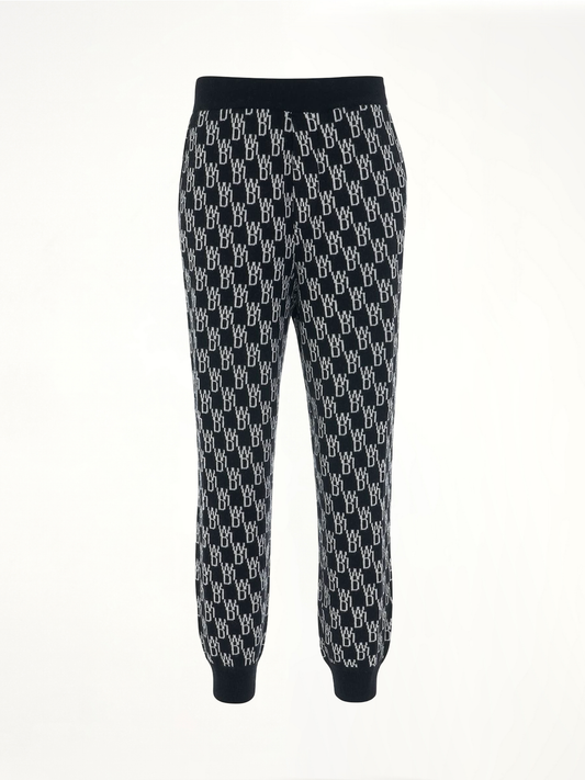 Image of a model wearing Pants. Productname: WE11DONE Monogram Knit Jacquard Trouser in Black colour by brand - WE11DONE