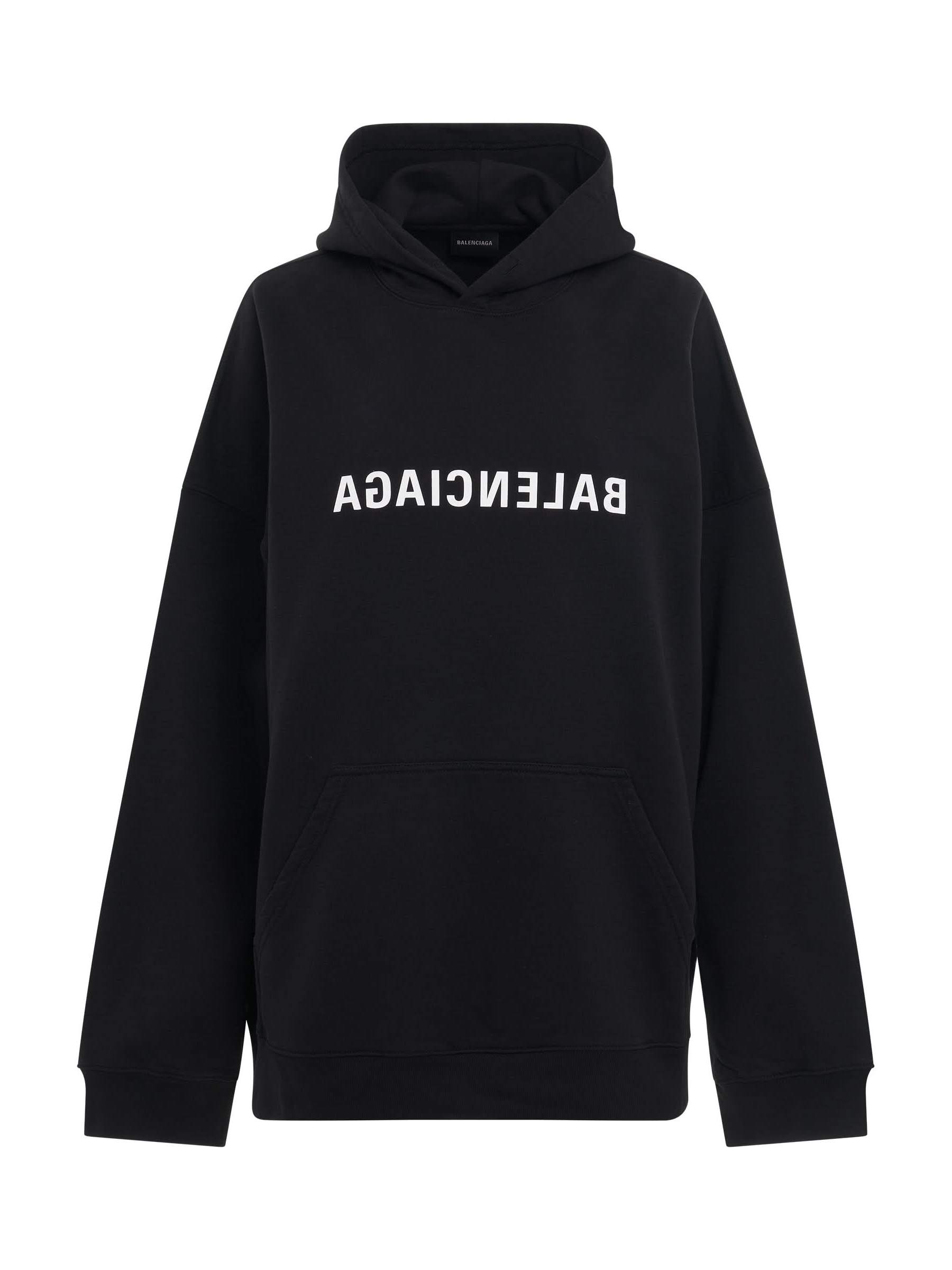 Image of a model wearing Outerwear. Productname: BALENCIAGA Mirror Print Wide Fit Hoodie in Black colour by brand - BALENCIAGA