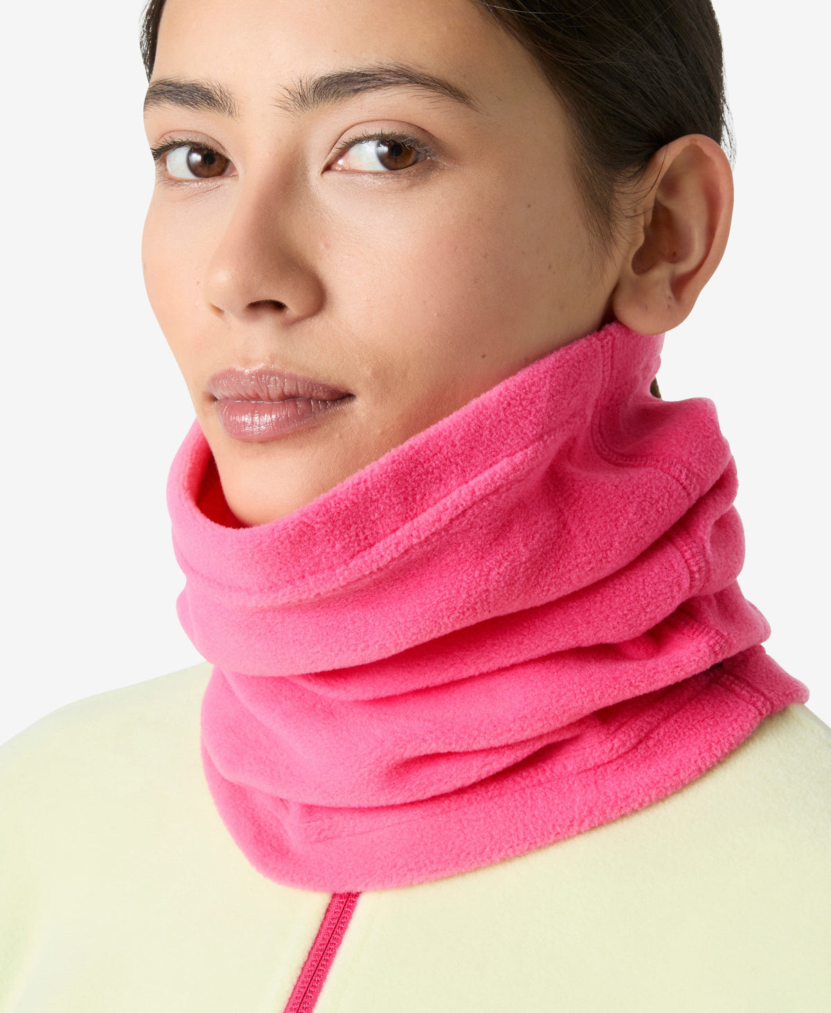 Image of a model wearing Outerwear. Product name - DAYBREAKER FLEECE NECK, Hot Pink in Hot Pink colour by brand - Helly Hansen