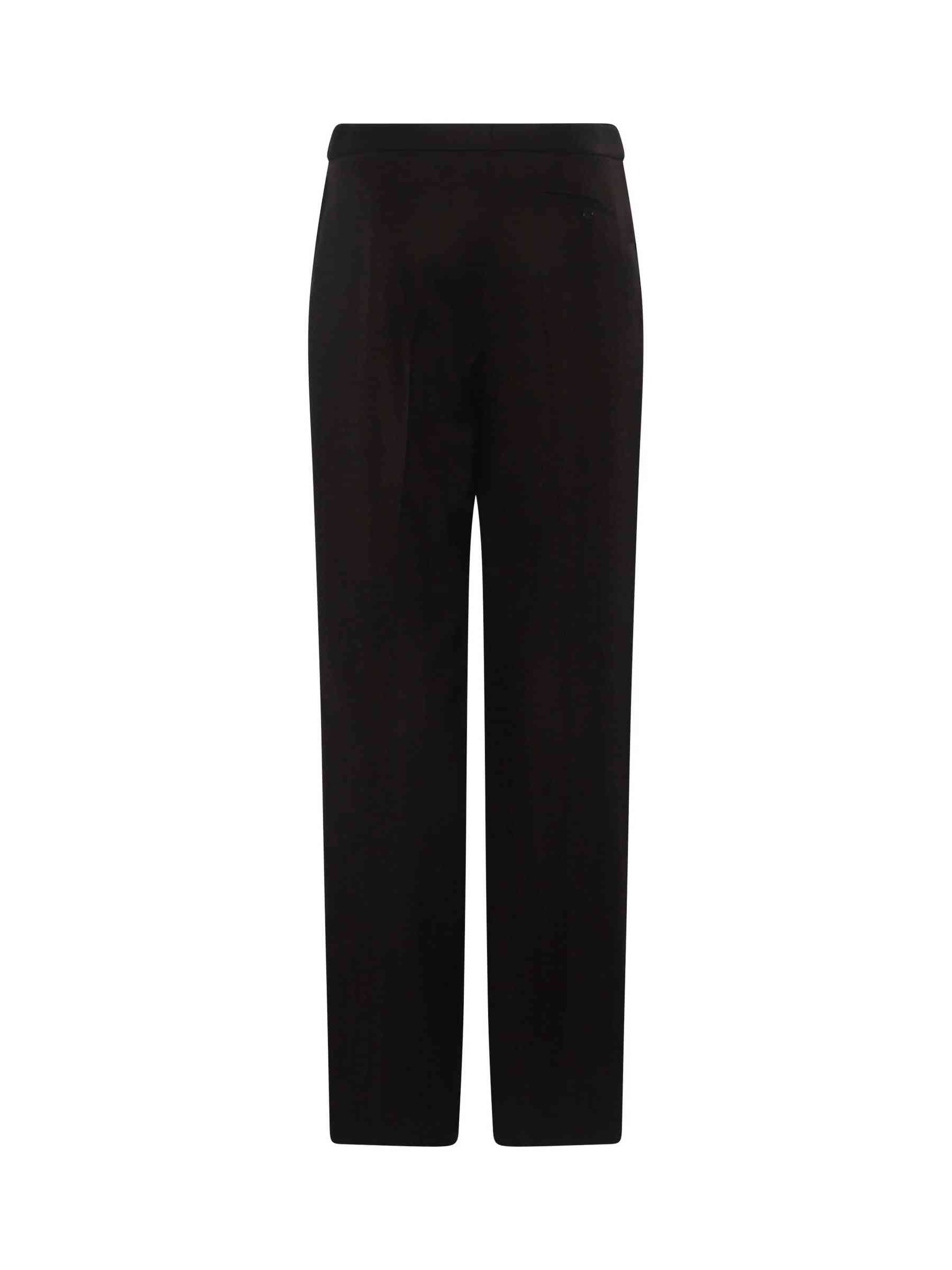 Image of a model wearing Pants. Productname: ALEXANDER MCQUEEN Herringbone Wide Leg Pants in Chocolate colour by brand - ALEXANDER MCQUEEN