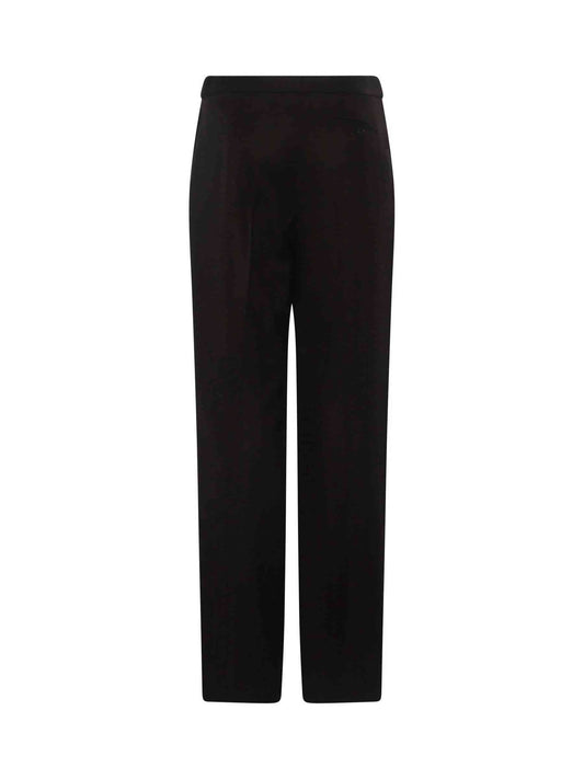 Image of a model wearing Pants. Productname: ALEXANDER MCQUEEN Herringbone Wide Leg Pants in Chocolate colour by brand - ALEXANDER MCQUEEN