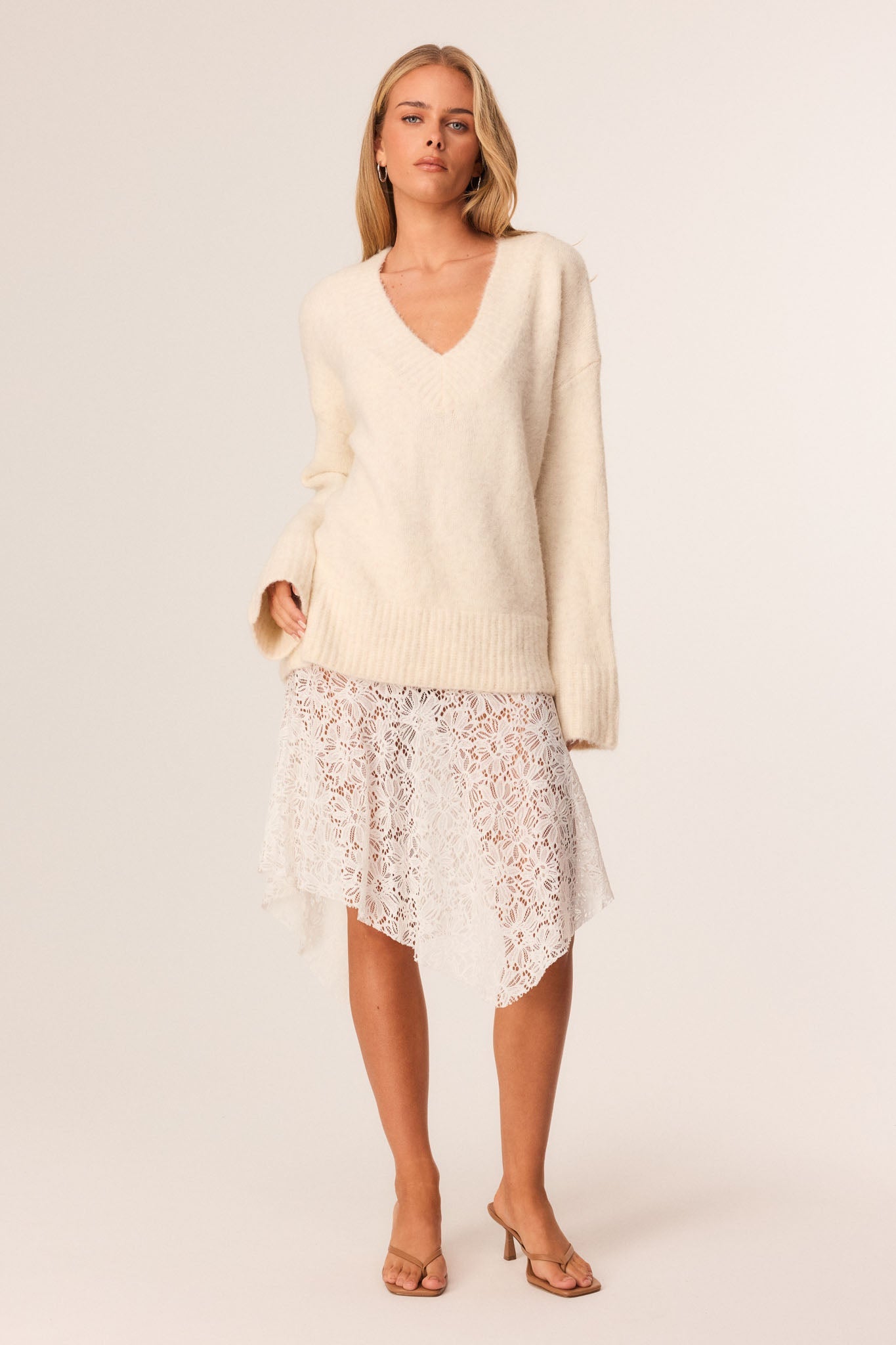 Image of a model wearing Skirts. Productname: SNDYS LILU MIDI SKIRT in White colour by brand - SNDYS