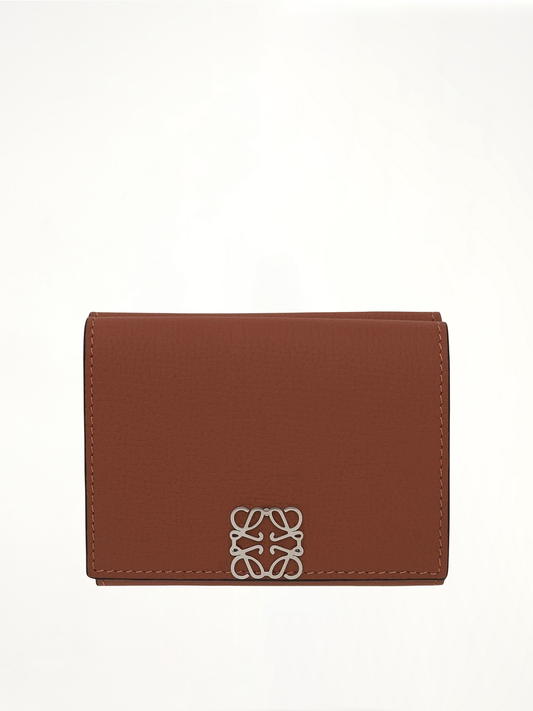 Image of Wallets & Money Clips. Product name - Anagram Trifold Wallet Pebble Grain Calfskin in Tan colour by brand - LOEWE