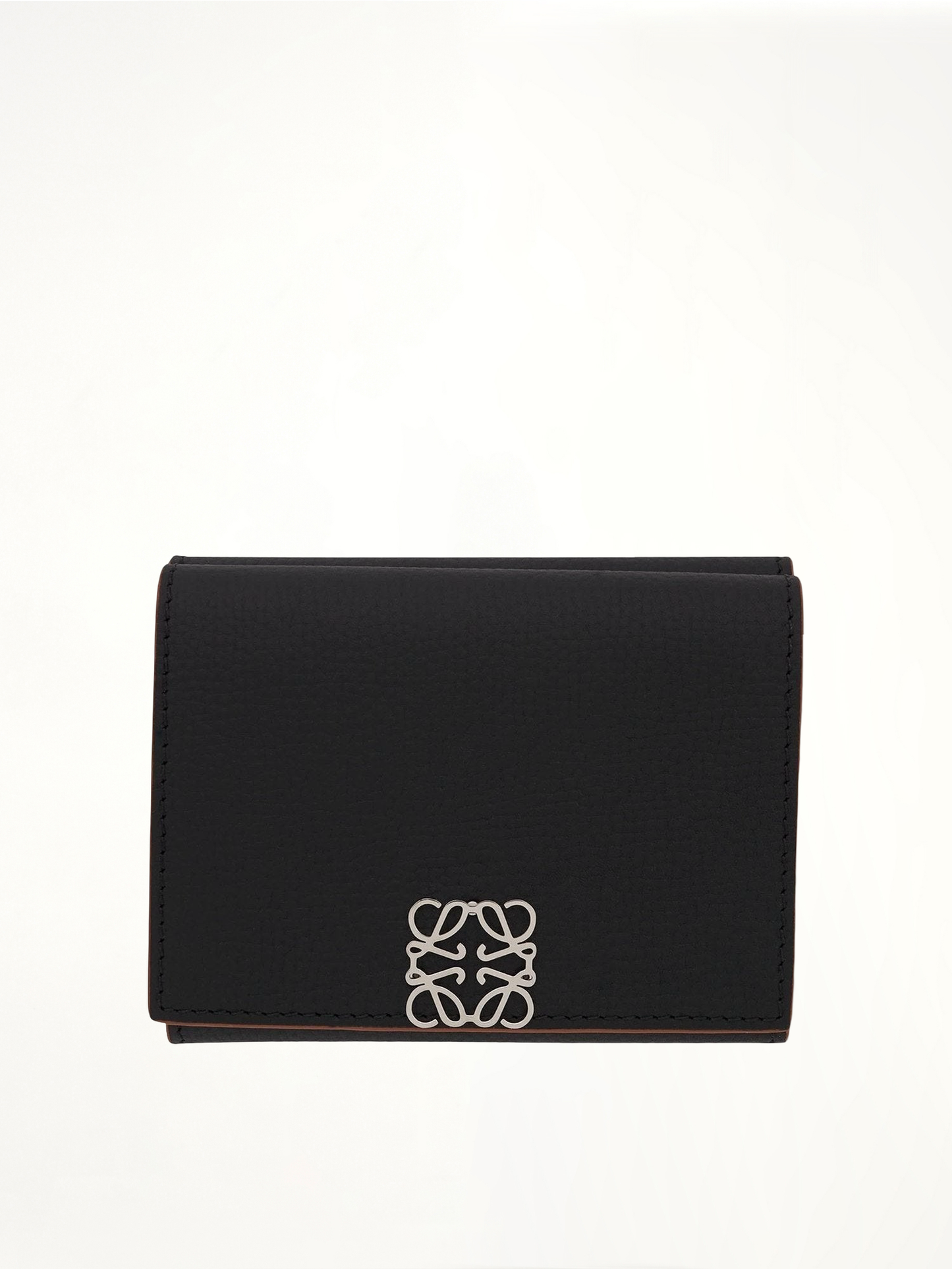 Image of Wallets & Money Clips. Product name - Anagram Trifold Wallet Pebble Grain Calfskin in Black colour by brand - LOEWE