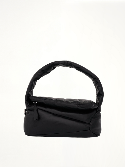 Image of a model wearing Outerwear. Productname: LOEWE Puffer Puzzle Hobo Bag in Black colour by brand - LOEWE