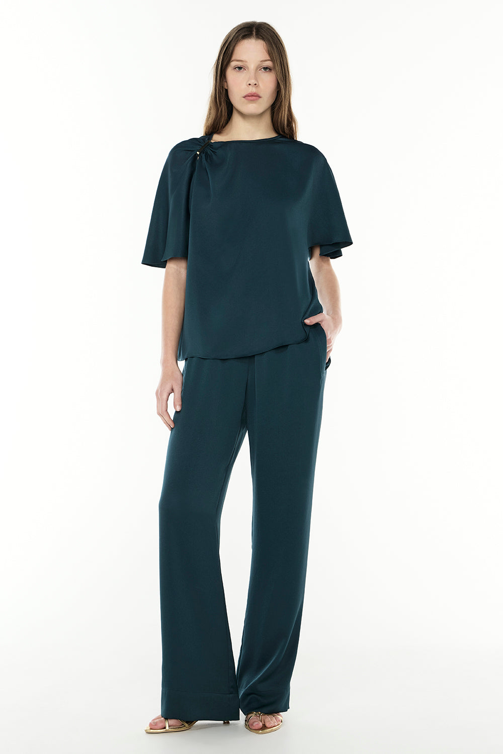 Image of a model wearing Tops. Productname: Your Song Top in TEAL colour by brand - Manning Cartell