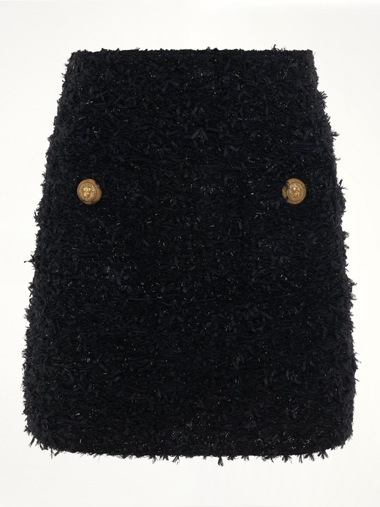 Image of a model wearing Skirts. Productname: BALMAIN High Waisted 2 Pockets Tweed Short Skirt in BLACK colour by brand - BALMAIN